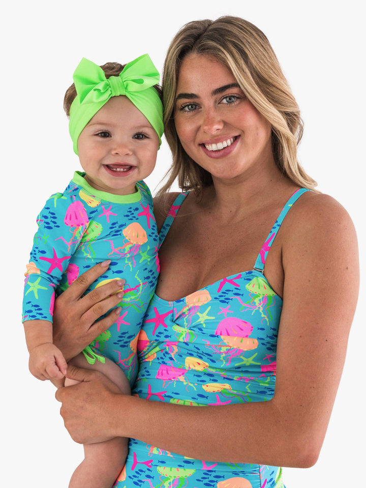 RuffleButts + RuggedButtsLong Sleeve One Piece Rash Guard Swimsuit - Neon Jelly Time