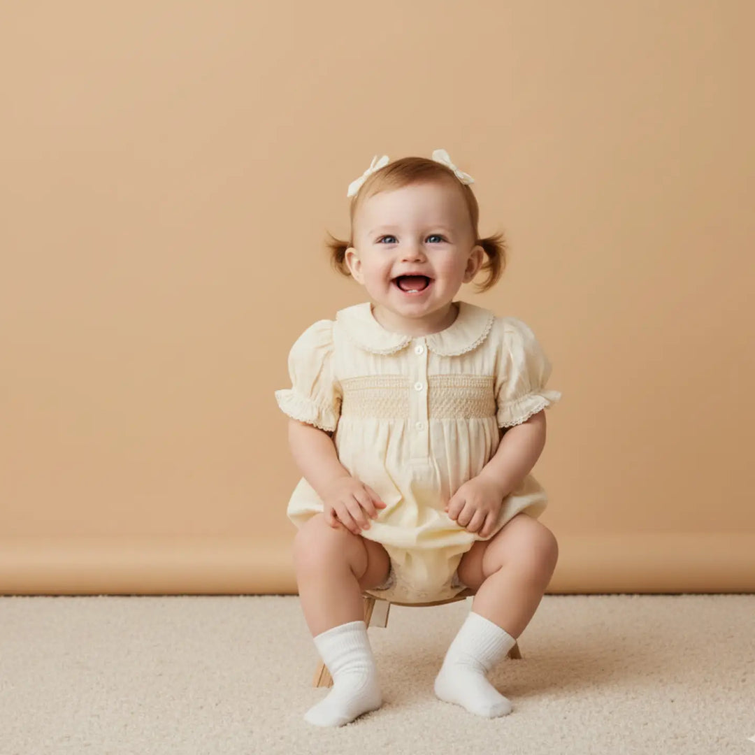 Makemake Organics Smocked Button Romper - Butter Yellow