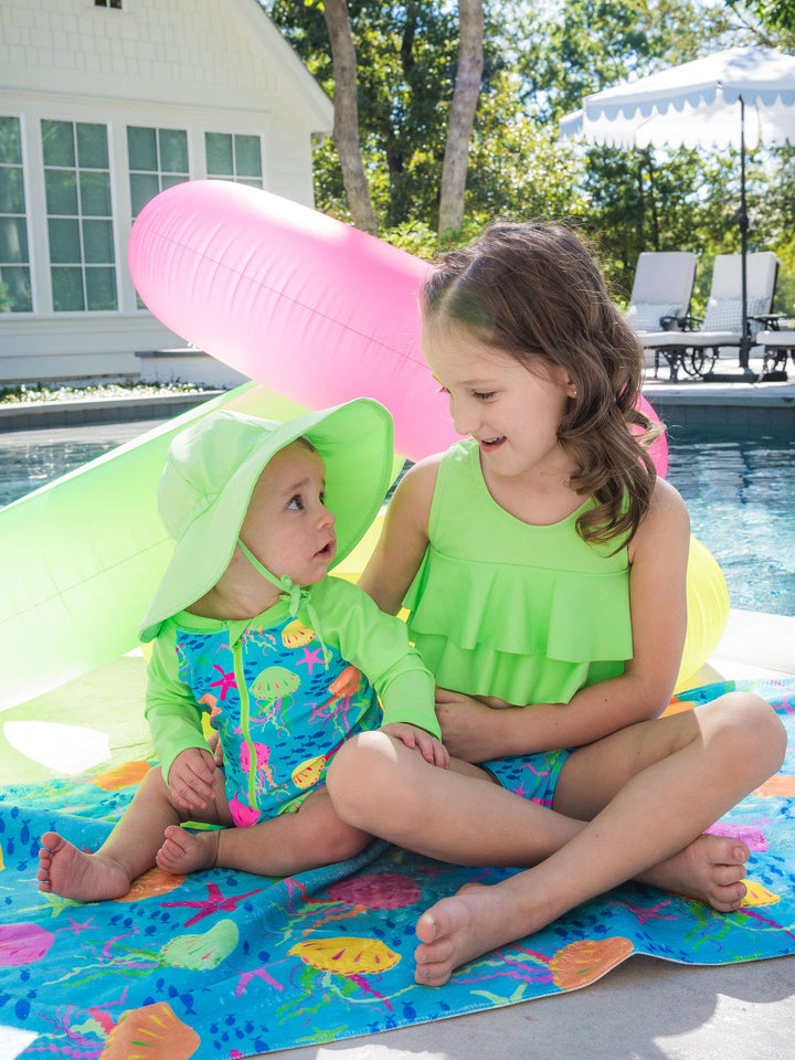 RuffleButts + RuggedButts Long Sleeve One Piece Rash Guard Swimsuit - Neon Jelly Time