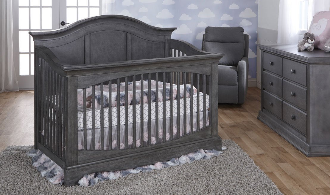 Grey crib with outlet drawers